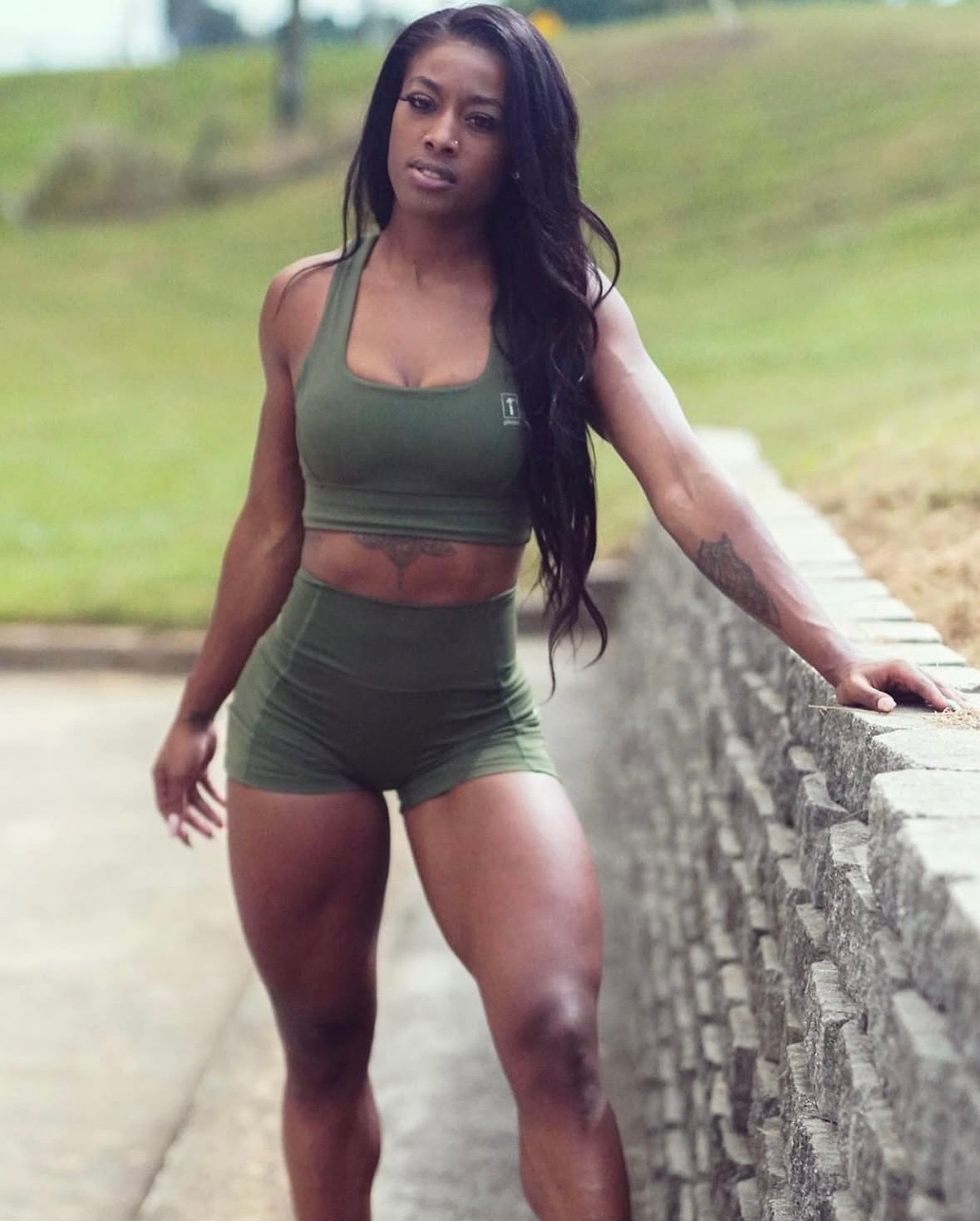 Ajiea Lee Hargrave in olive activewear outdoors